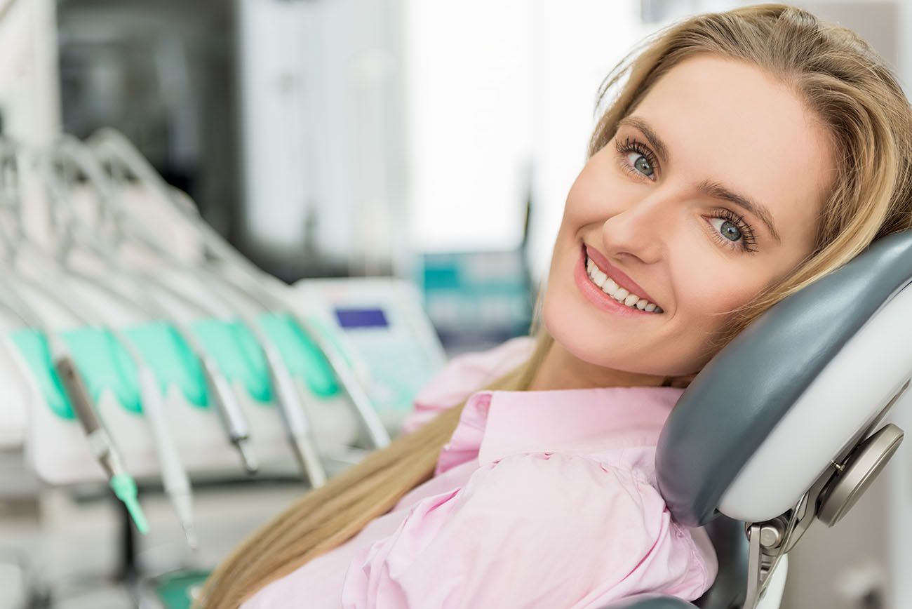 Image of woman in dental chair smiling straight white teeth cosmetic dentistry dentist in Chester Springs Pennsylvania